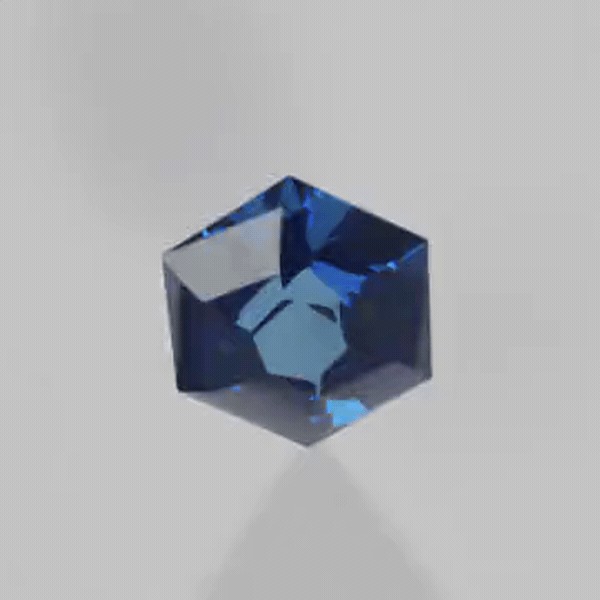 Akhavan's Glass Shard Vortex faceting design rendered as blue sapphire, turning to show the fire move across the facets